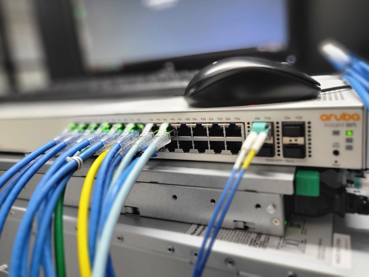 Aruba network switch with fiber and copper cabling